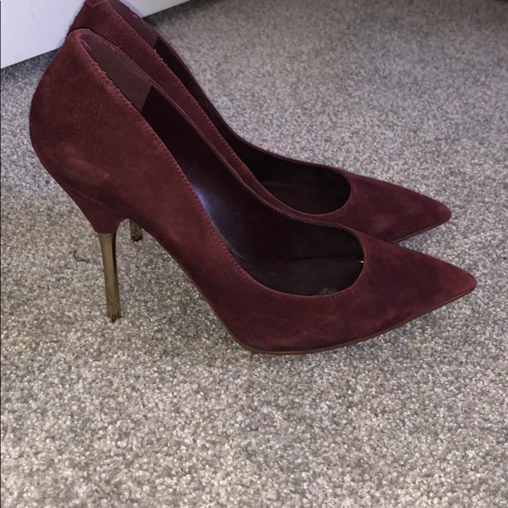 Bebe burgundy suede and gold pumps